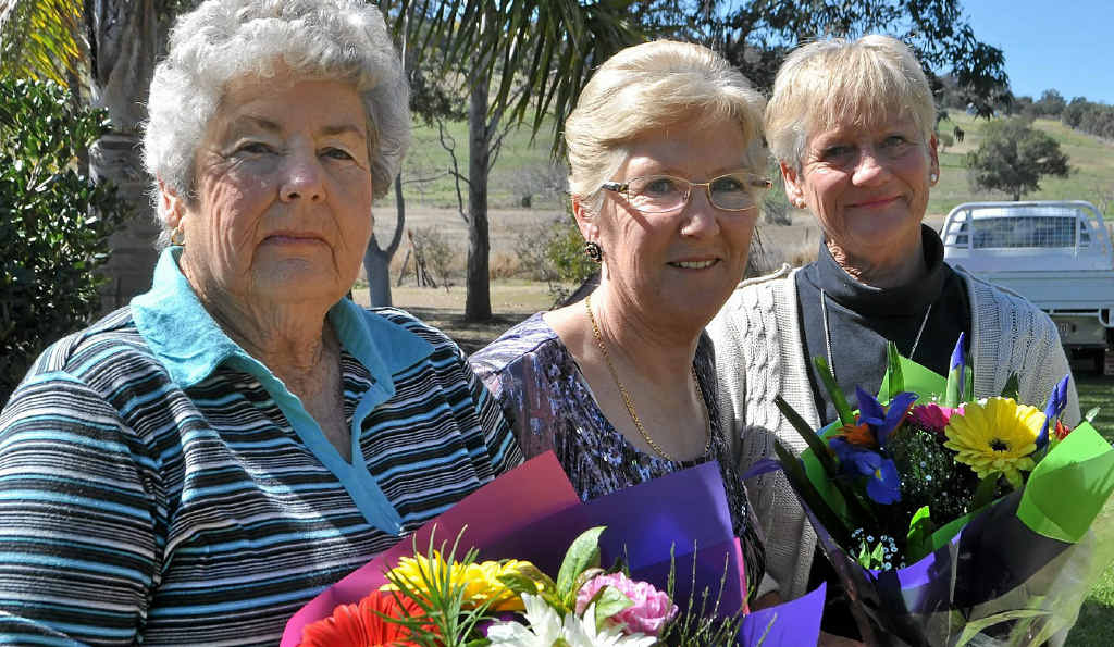 Rita Ridyard (centre) is off to England to begin another chapter of her life. She gave her friend Margaret Buchner (left) and sister Nadine Horneman a bunch of flowers at her farewell. Rita Ridyard (centre) is off to England to begin another chapter of her life. She gave her friend Margaret Buchner (left) and sister Nadine Horneman a bunch of flowers at her farewell.